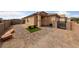Paver driveway and walkway with small patch of green with bench, leading to the home's entrance at 4611 Julesburg Dr, Las Vegas, NV 89139