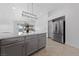 Spacious kitchen island with white countertops offers extra seating, a stainless steel refrigerator, and pool view at 4611 Julesburg Dr, Las Vegas, NV 89139