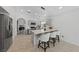 Modern kitchen features a large island with barstool seating, stainless steel appliances, and ample lighting at 4611 Julesburg Dr, Las Vegas, NV 89139