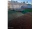 Spacious backyard ready for landscaping with a trampoline and basketball hoop at 4868 Treetrunk Ave, Las Vegas, NV 89147