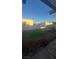 Backyard is ready for landscaping and features a trampoline and a small patch of turf at 4868 Treetrunk Ave, Las Vegas, NV 89147