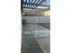 Backyard patio with a wooden pergola and ready for landscaping at 4868 Treetrunk Ave, Las Vegas, NV 89147