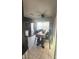 Bright dining area featuring modern decor, tiled flooring, and large windows at 4868 Treetrunk Ave, Las Vegas, NV 89147