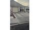 Home featuring a two-car garage and covered carport at 4868 Treetrunk Ave, Las Vegas, NV 89147