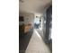 Home featuring a long hallway connecting the living room and kitchen area at 4868 Treetrunk Ave, Las Vegas, NV 89147