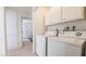Clean and organized laundry area with modern washer and dryer at 4868 Treetrunk Ave, Las Vegas, NV 89147