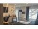 Bright living room with views to other rooms and a large window at 4868 Treetrunk Ave, Las Vegas, NV 89147
