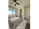 Cozy bedroom with large window offering city views, features a neutral color scheme, and ample closet space at 492 Pear Lake St, Las Vegas, NV 89138