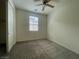 Bedroom with carpeted floor, window, and ceiling fan at 492 Pear Lake St, Las Vegas, NV 89138