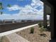 Patio area with desert landscaping and paved walkway, offering scenic views of homes at 492 Pear Lake St, Las Vegas, NV 89138
