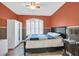 Warm bedroom with plantation shutters, a full sized bed and access to a closet at 4932 Forest Oaks Dr, Las Vegas, NV 89149