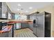Modern kitchen featuring stainless steel appliances, sleek cabinets, and warm wood countertops at 4932 Forest Oaks Dr, Las Vegas, NV 89149
