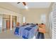 Comfortable main bedroom with tile floors, closet, and ensuite bath access at 4932 Forest Oaks Dr, Las Vegas, NV 89149
