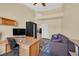 Cozy home office with desk, sofa, and ample natural light at 4932 Forest Oaks Dr, Las Vegas, NV 89149