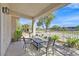 Outdoor patio with seating, landscaping, and golf course views at 4932 Forest Oaks Dr, Las Vegas, NV 89149