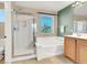 Bathroom features separate shower and tub, double sink vanity, and tile floors at 5120 First Sun St, North Las Vegas, NV 89081