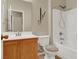 Clean bathroom featuring tile floors, a single sink vanity, toilet, and a shower/tub combo at 5120 First Sun St, North Las Vegas, NV 89081