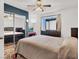 Bedroom featuring ceiling fan, and sliding mirrored closet doors at 5120 First Sun St, North Las Vegas, NV 89081