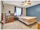 Bedroom with carpet, ceiling fan, window, and small shelf at 5120 First Sun St, North Las Vegas, NV 89081