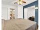 Bedroom featuring sliding mirrored closet doors and a ceiling fan at 5120 First Sun St, North Las Vegas, NV 89081