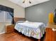 A cozy bedroom with a hardwood floors, a ceiling fan and dresser at 5120 First Sun St, North Las Vegas, NV 89081