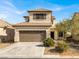 Charming two-story home with a well-manicured front yard and a two-car garage at 5120 First Sun St, North Las Vegas, NV 89081