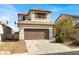 Inviting two-story home featuring a neutral color scheme and a convenient two-car garage at 5120 First Sun St, North Las Vegas, NV 89081