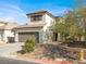 Attractive two-story home showcasing a desert landscape, two-car garage and charming shutters at 5120 First Sun St, North Las Vegas, NV 89081