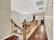 Upstairs hallway featuring hardwood floors, staircase, and neutral color walls at 5120 First Sun St, North Las Vegas, NV 89081