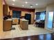 This spacious kitchen has wooden cabinets, an island, and stainless steel appliances at 5120 First Sun St, North Las Vegas, NV 89081