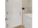 A well-lit laundry room with a washer, dryer, and easy outdoor access at 5120 First Sun St, North Las Vegas, NV 89081