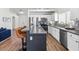 Kitchen island with bar seating, stainless steel appliances, and granite countertops at 5227 Zebra Ct, North Las Vegas, NV 89031