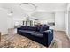 Open-concept living room and kitchen featuring modern lighting and neutral paint palette at 5227 Zebra Ct, North Las Vegas, NV 89031