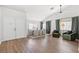 Open-concept living and dining area featuring hardwood floors, recessed lighting, and neutral décor at 5227 Zebra Ct, North Las Vegas, NV 89031