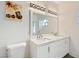 Bright bathroom featuring a double vanity with white cabinets and accent art at 5415 W Harmon Ave # 1074, Las Vegas, NV 89103