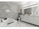 Modern bathroom with sleek fixtures, double vanity, and luxurious tub at 5415 W Harmon Ave # 1074, Las Vegas, NV 89103