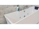 A close-up of a modern soaking tub with jet tub features at 5415 W Harmon Ave # 1074, Las Vegas, NV 89103