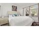 Cozy bedroom with a queen bed, soft bedding, and natural light from the window at 5415 W Harmon Ave # 1074, Las Vegas, NV 89103