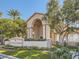 Opulence Condos community entrance with manicured lawns, lush trees, and attractive signage at 5415 W Harmon Ave # 1074, Las Vegas, NV 89103