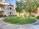 Lush community green space with mature trees, walking paths, and well-maintained landscaping at 5415 W Harmon Ave # 1074, Las Vegas, NV 89103