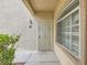Building exterior featuring a secured front entry and garden area at 5415 W Harmon Ave # 1074, Las Vegas, NV 89103