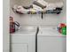 Laundry room with washer, dryer, and overhead storage for convenience at 5415 W Harmon Ave # 1074, Las Vegas, NV 89103