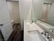 Bathroom featuring dual sinks, white quartz countertop, large mirror and modern faucets at 545 Thea St # 1315, Henderson, NV 89052