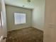 Bedroom featuring neutral walls and carpet with a window providing natural light at 545 Thea St # 1315, Henderson, NV 89052