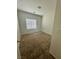 Cozy bedroom with neutral carpet and a window providing natural light at 545 Thea St # 1315, Henderson, NV 89052