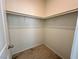 Walk-in closet featuring neutral carpet and bars for hangers to organize clothing and accessories at 545 Thea St # 1315, Henderson, NV 89052