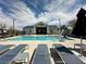 Resort-style community pool with ample seating and shaded lounging areas, perfect for relaxation and recreation at 545 Thea St # 1315, Henderson, NV 89052