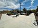 Inviting pool area with a covered pavilion, tables, and lush landscaping, perfect for community gatherings and relaxation at 545 Thea St # 1315, Henderson, NV 89052