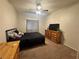 A serene bedroom featuring carpet flooring, with a full bed, and ample natural light from the window at 5650 E Sahara Ave # 1035, Las Vegas, NV 89142