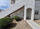 Exterior angle of a multi-level condo with stairs and a sidewalk and a door on the first level at 5650 E Sahara Ave # 1035, Las Vegas, NV 89142